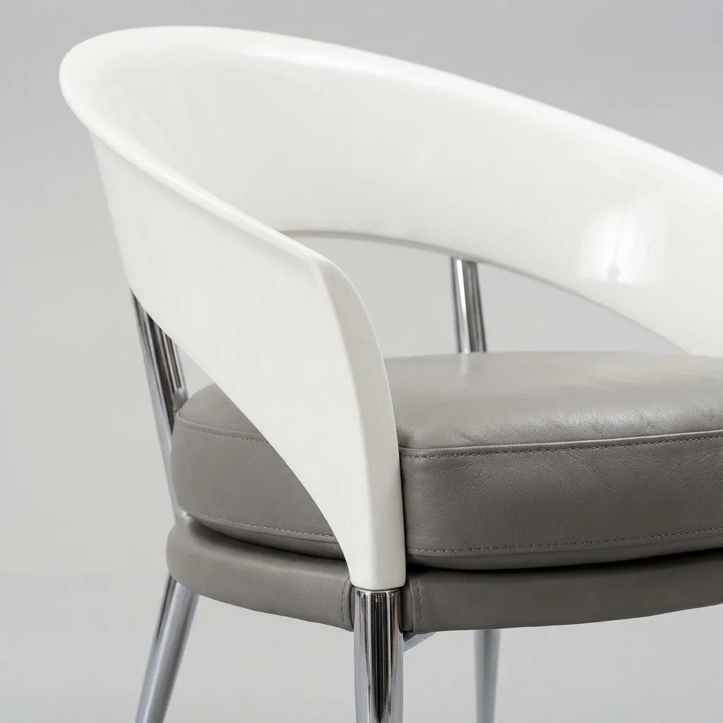 Close-up of the white lacquered crescent back and the grey leather seat
