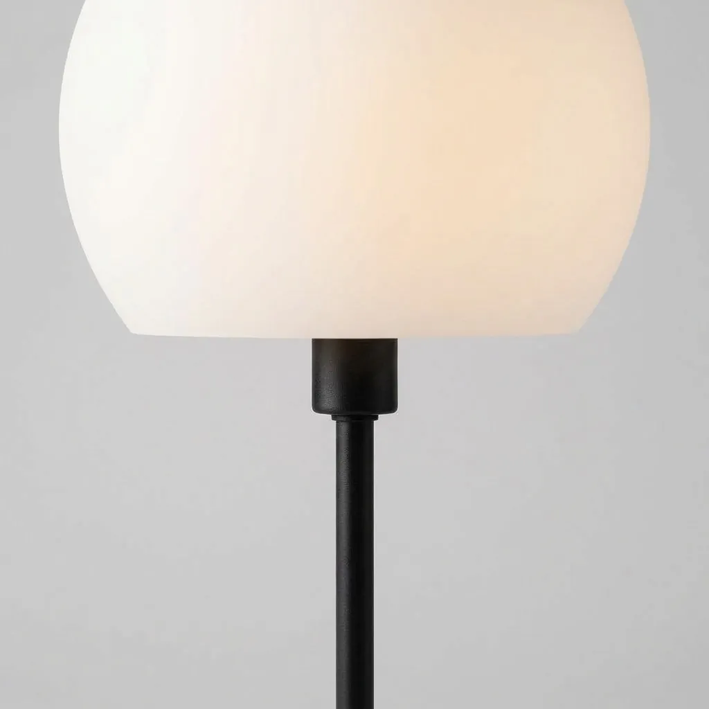 Close-up of the frosted opal glass globe on its black stem