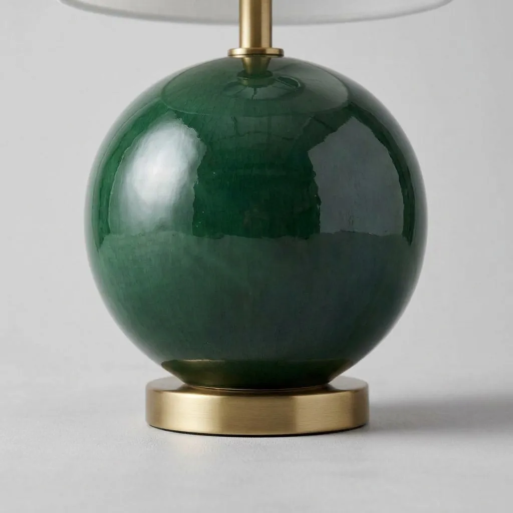 Close-up of the glossy green ceramic and the brass base