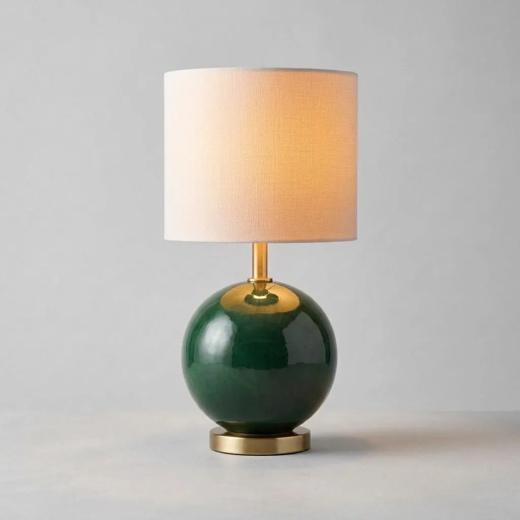 The same lamp switched on, the linen shade glowing warmly
